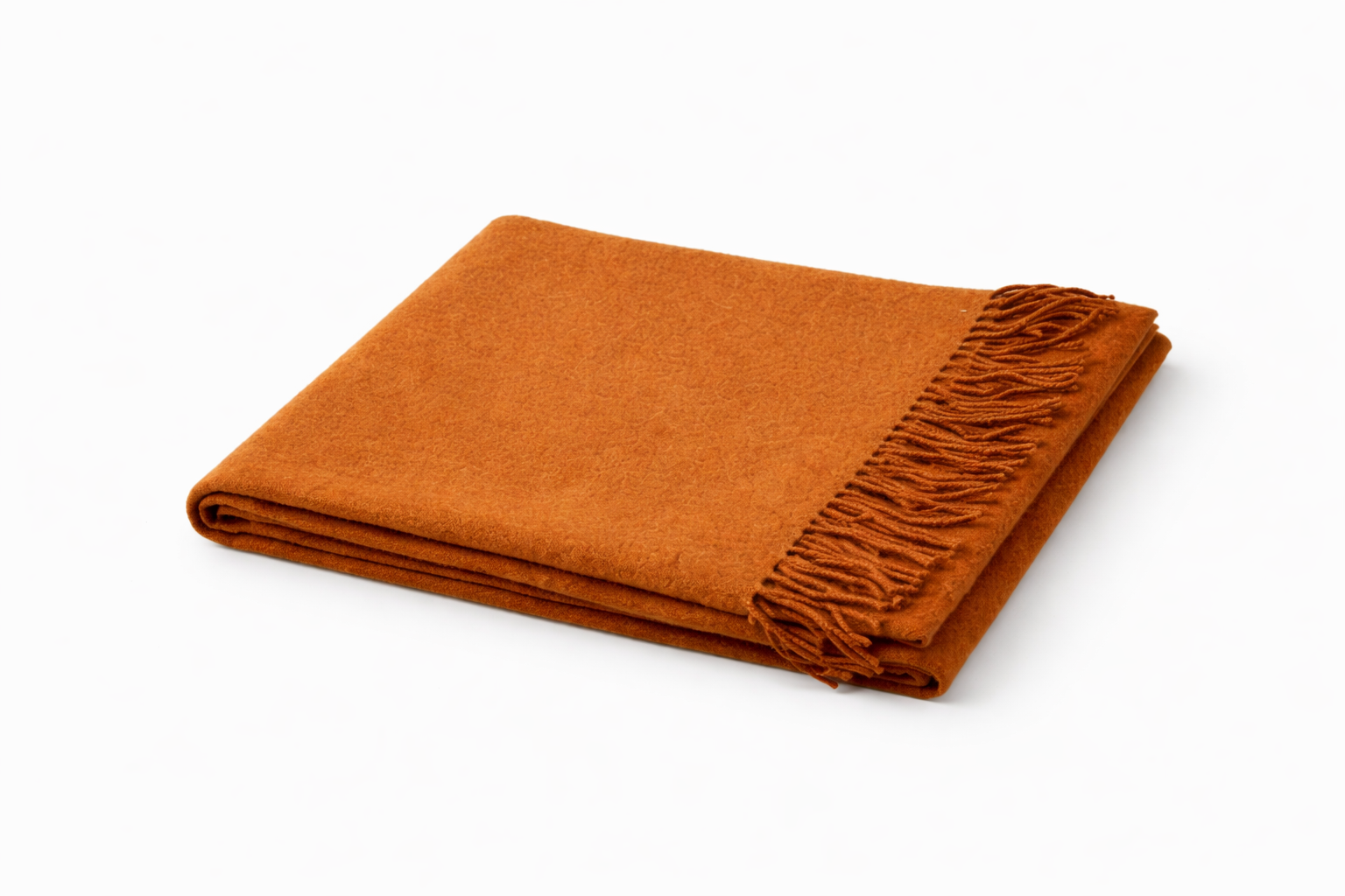 Folded thick wool scarf in rust brown on a white background